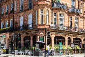 A red-brick Victorian corner building on a London street